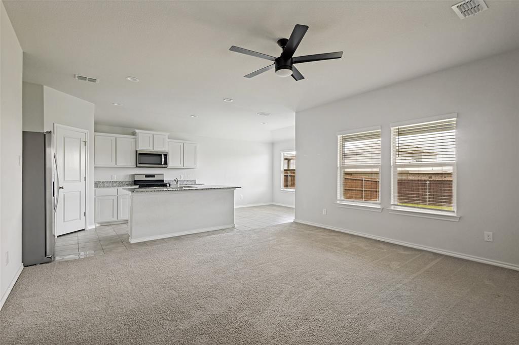 621 Spaulding Street Justin, TX 76247 - Photo 5 of 22 a view of kitchen with sink refrigerator and window