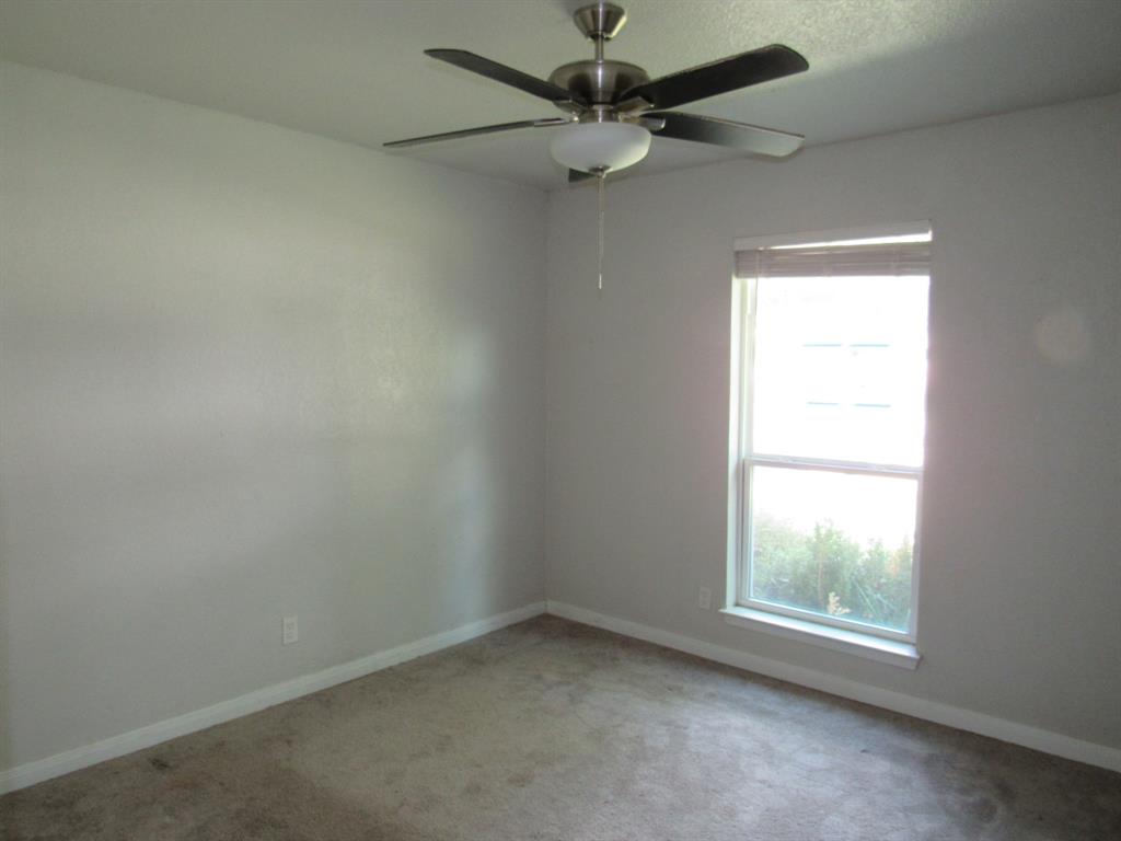 2104 Dan Rowe Street Waco, TX 76704 - Photo 11 of 14 an empty room with a window and a fan
