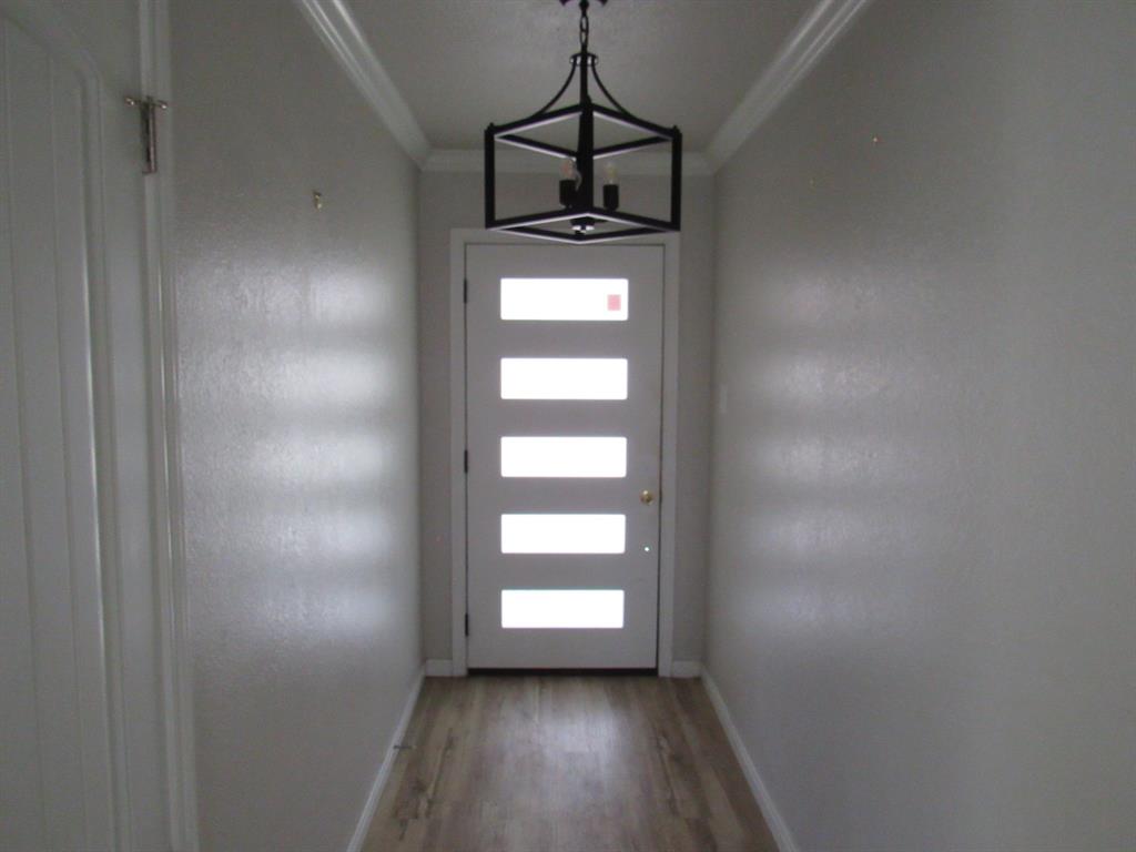2104 Dan Rowe Street Waco, TX 76704 - Photo 2 of 14 a view of empty room with wooden floor and window