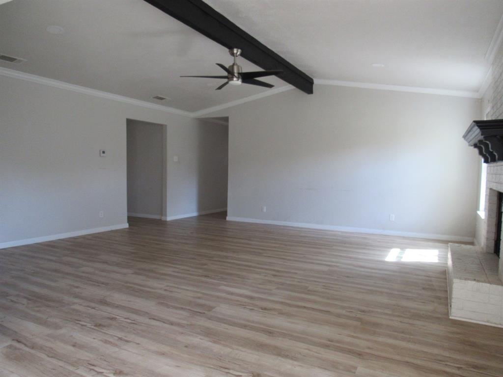 2104 Dan Rowe Street Waco, TX 76704 - Photo 4 of 14 a view of an empty room with wooden floor