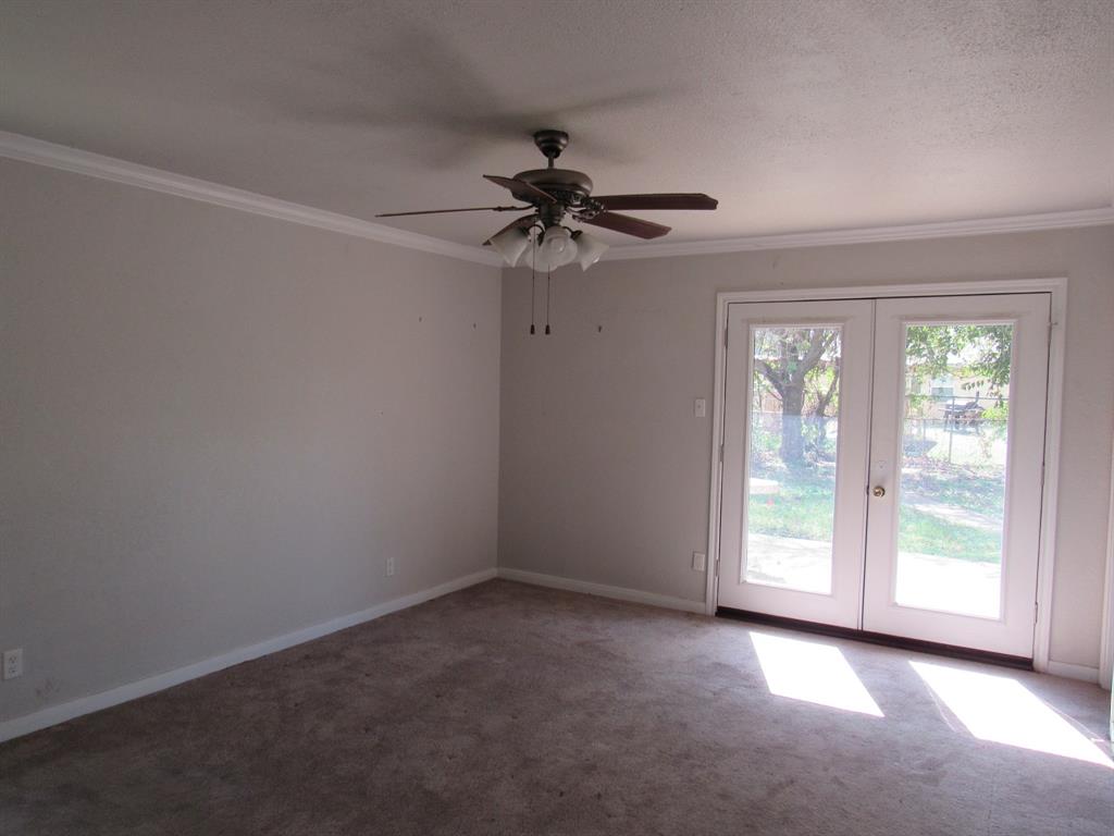 2104 Dan Rowe Street Waco, TX 76704 - Photo 7 of 14 wooden floor in an empty room with a window
