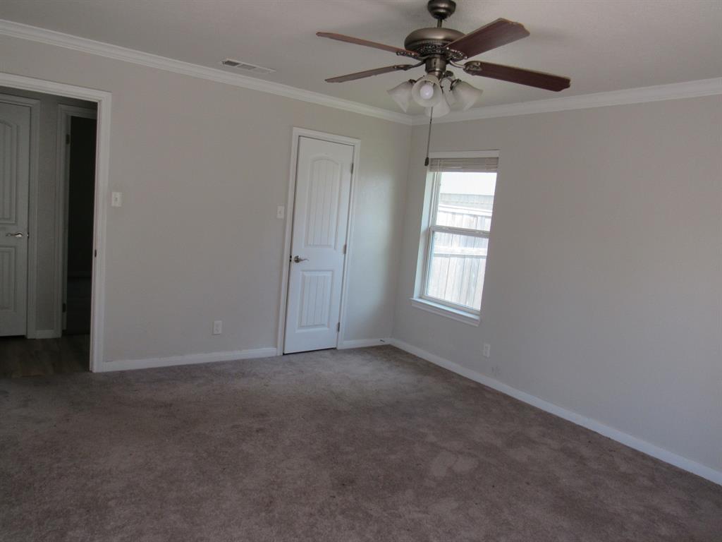 2104 Dan Rowe Street Waco, TX 76704 - Photo 8 of 14 a view of a livingroom with a ceiling fan and window