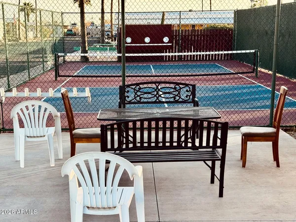 a view of a swimming pool and lounge chair