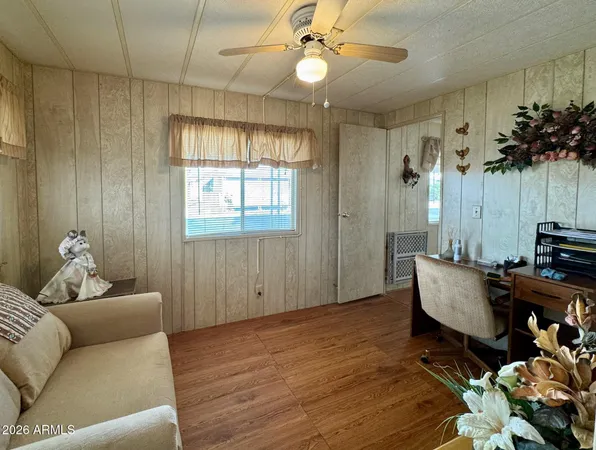 a living room with furniture and a window
