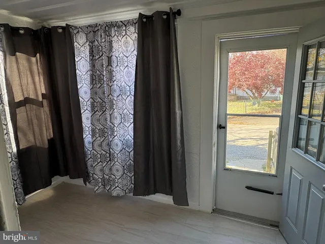 a view of walk in closet with clothes