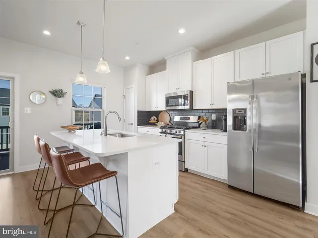 an aerial view of a house with a yard and lake view