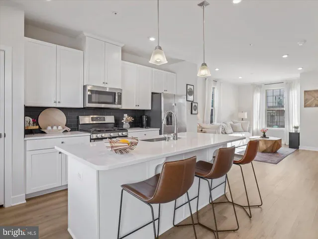 a view of a lake with a floor to ceiling window and a yard