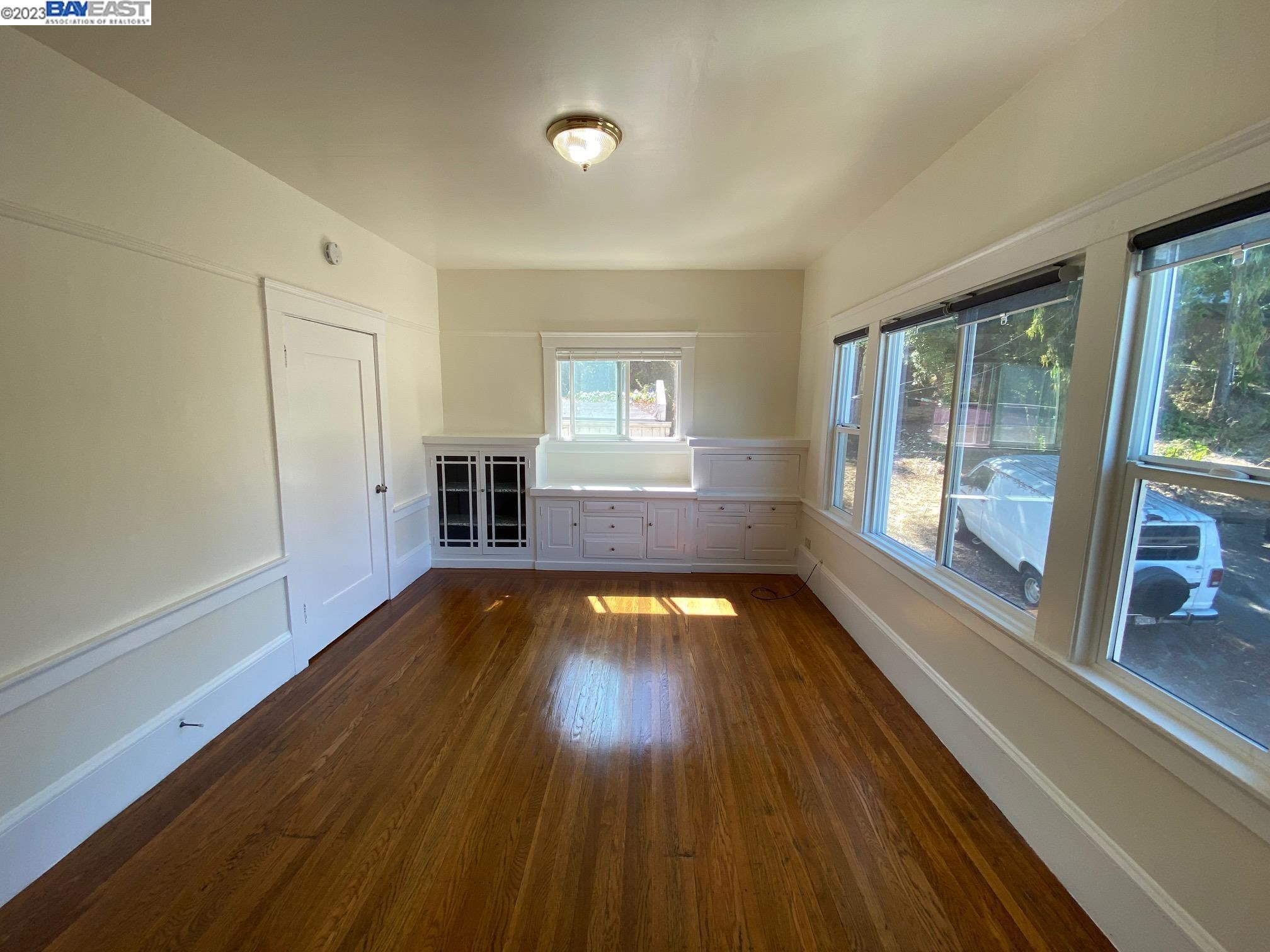Ivy Hill Oakland, CA 94606 - Photo 17 of 19 a view of empty room with wooden floor and fan