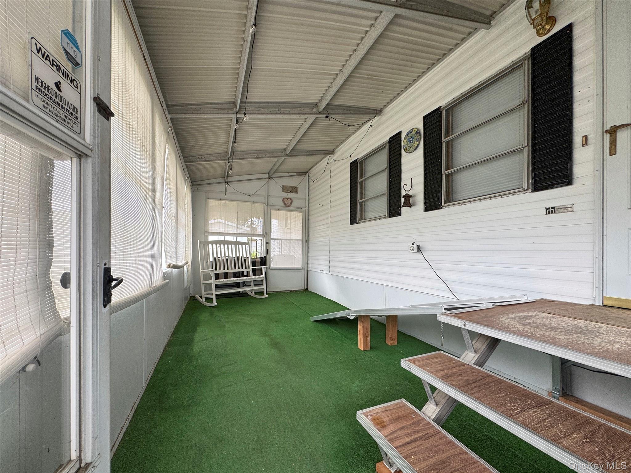 1964 River Road, Unit 55 Calverton, NY 11933 - Photo 12 of 13 a view of a backyard with chair