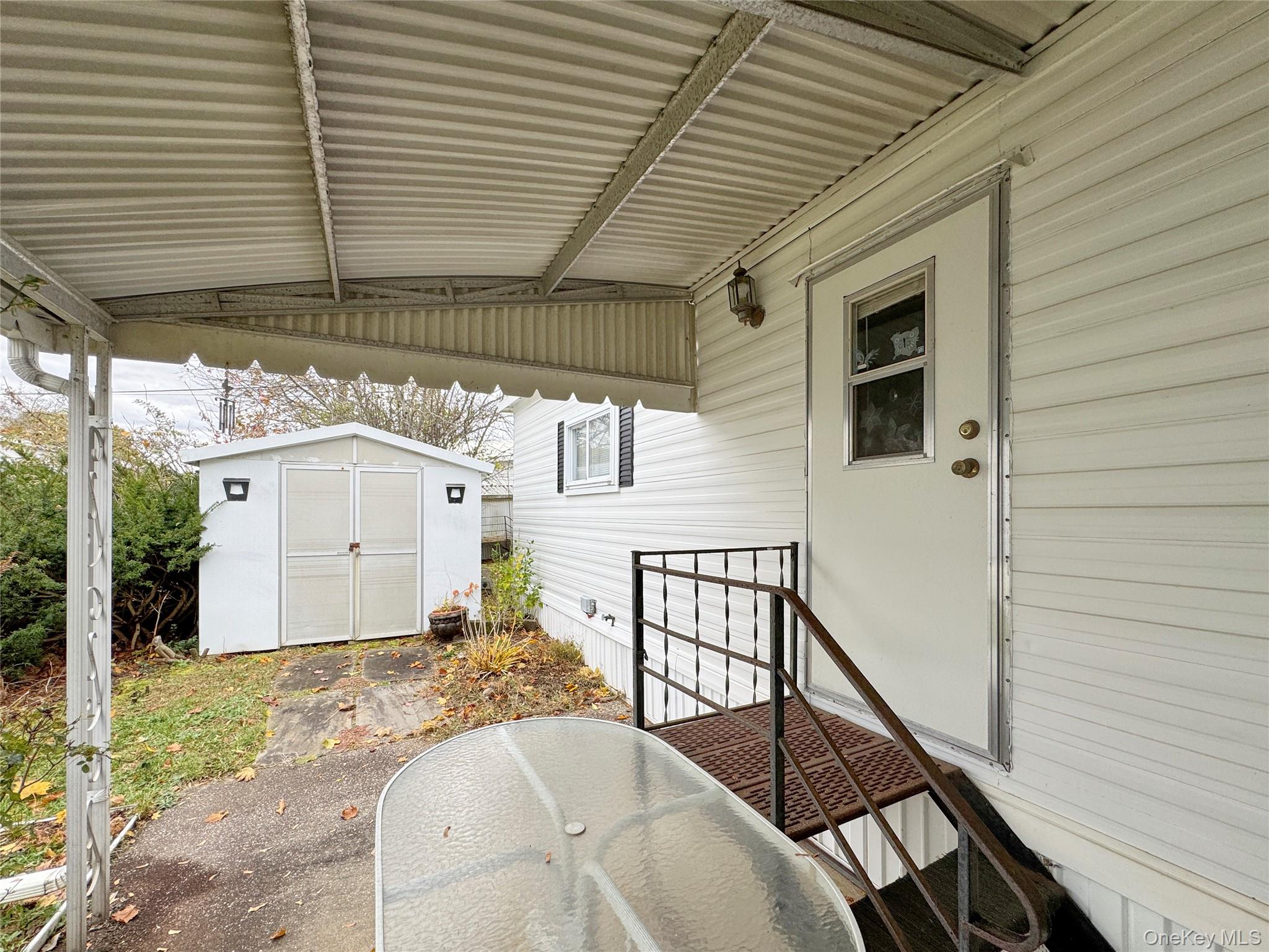 1964 River Road, Unit 55 Calverton, NY 11933 - Photo 13 of 13 a view of a porch