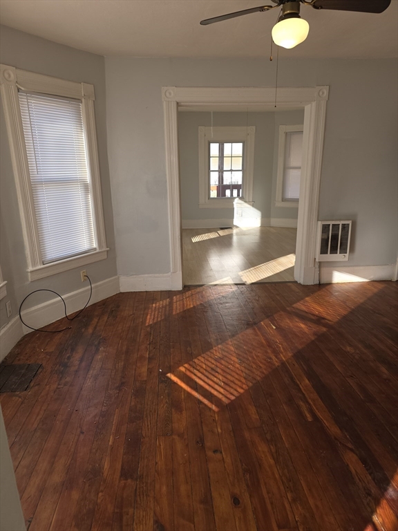 34 Qunicy, Unit 1 Springfield, MA 01109 - Photo 1 of 7 wooden floor in an empty room with a window