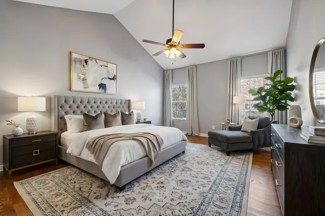 a bedroom with a bed and a couch