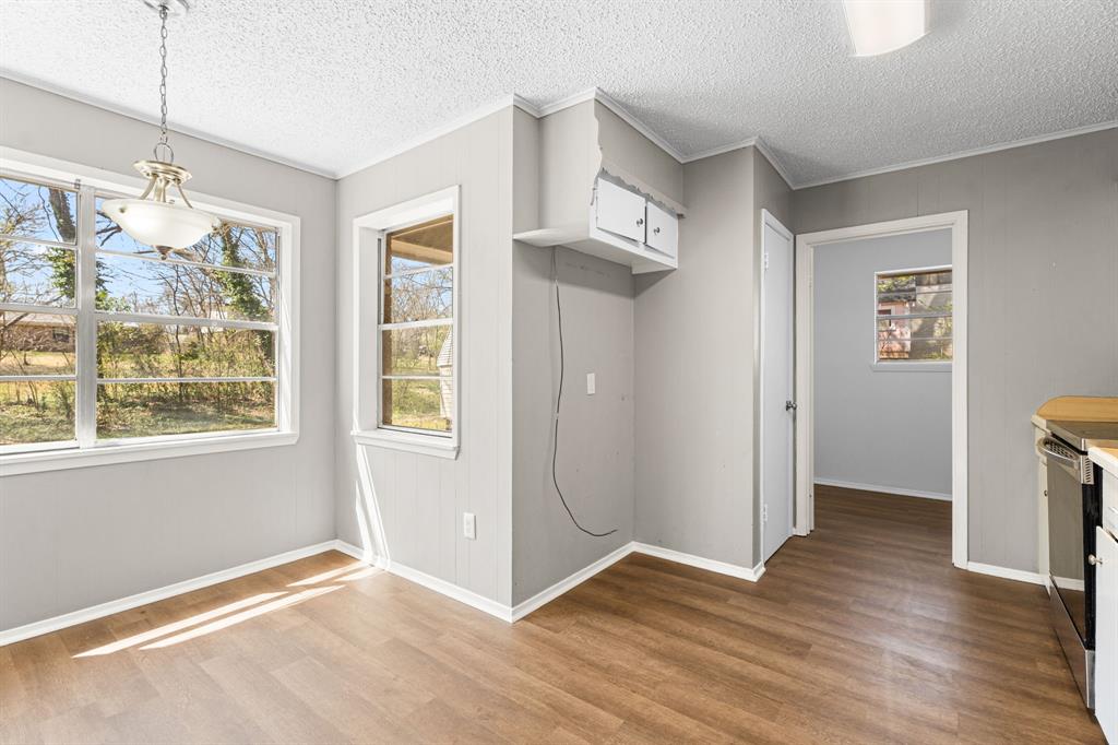 685 Sides Circle Canton, TX 75103 - Photo 14 of 32 a view of an empty room with wooden floor and a window