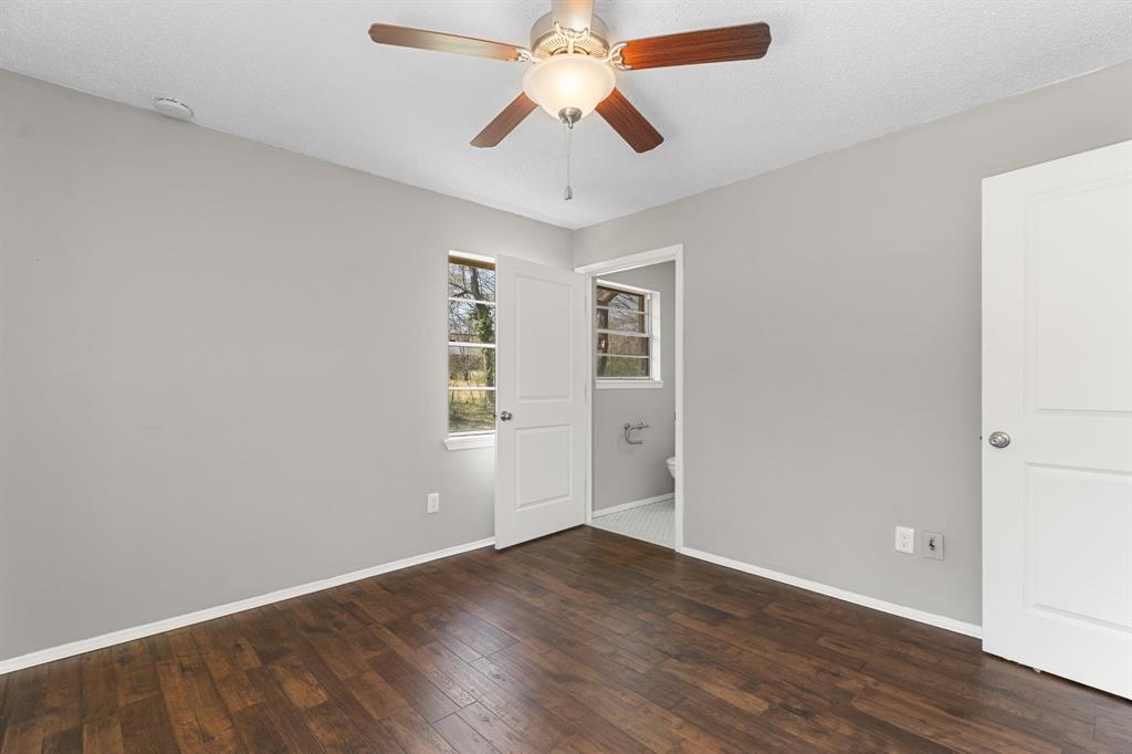 685 Sides Circle Canton, TX 75103 - Photo 15 of 32 wooden floor in an empty room with a window