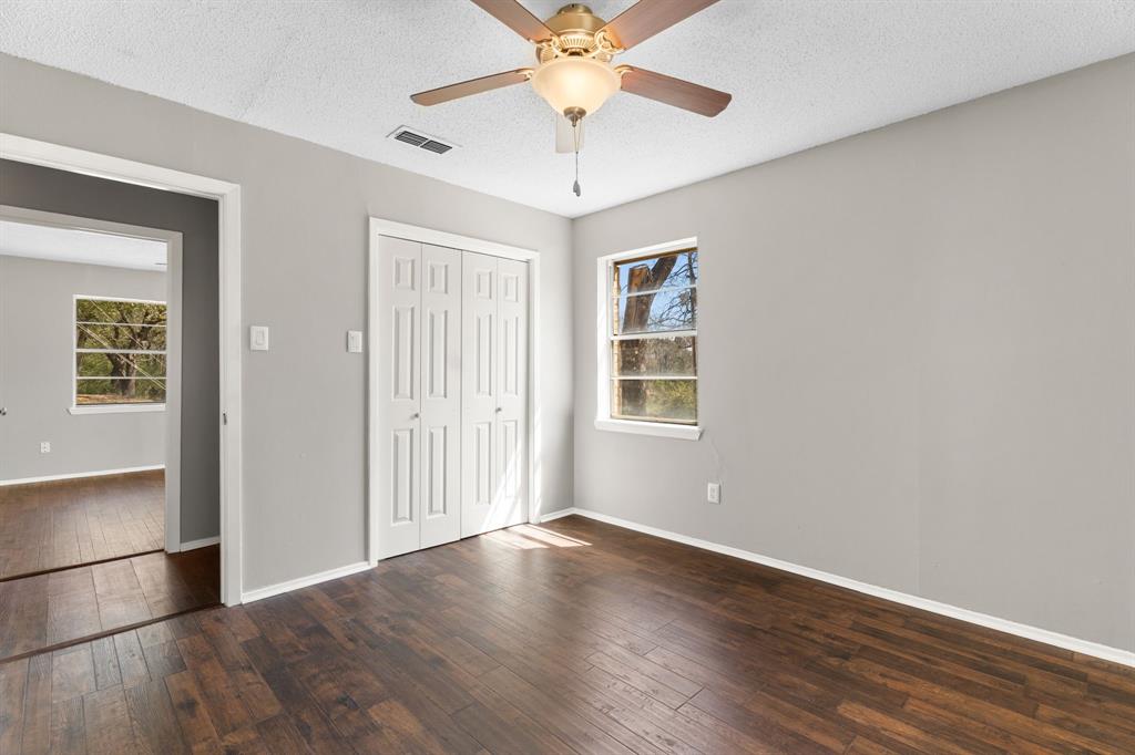 685 Sides Circle Canton, TX 75103 - Photo 17 of 32 wooden floor in an empty room with a window
