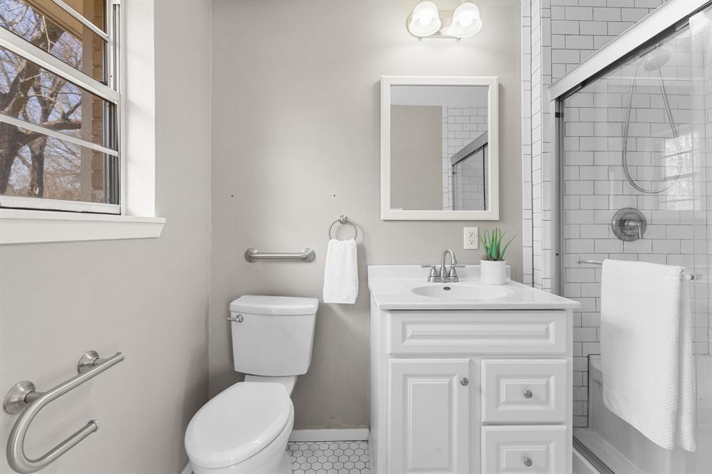 685 Sides Circle Canton, TX 75103 - Photo 19 of 32 a bathroom with a sink a toilet and mirror