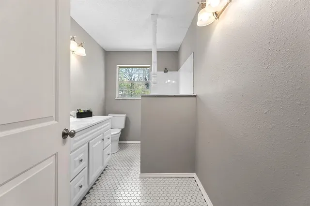 a bathroom with a sink a vanity and a mirror