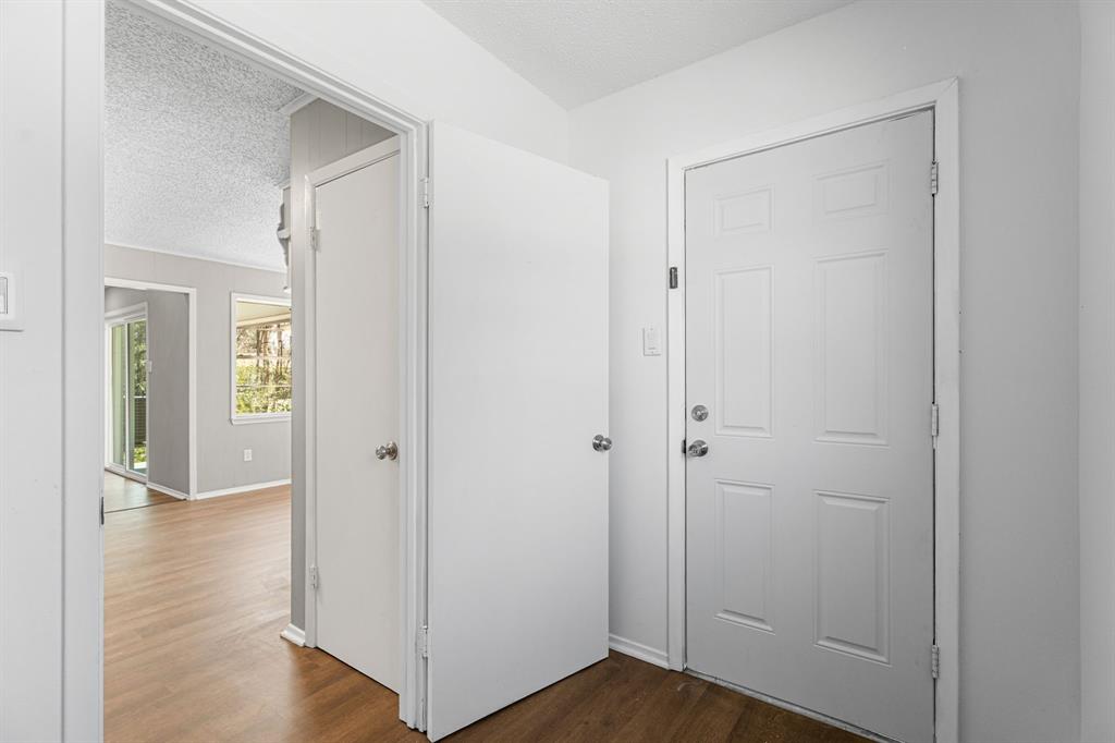 685 Sides Circle Canton, TX 75103 - Photo 26 of 32 a view of a hallway with wooden floor