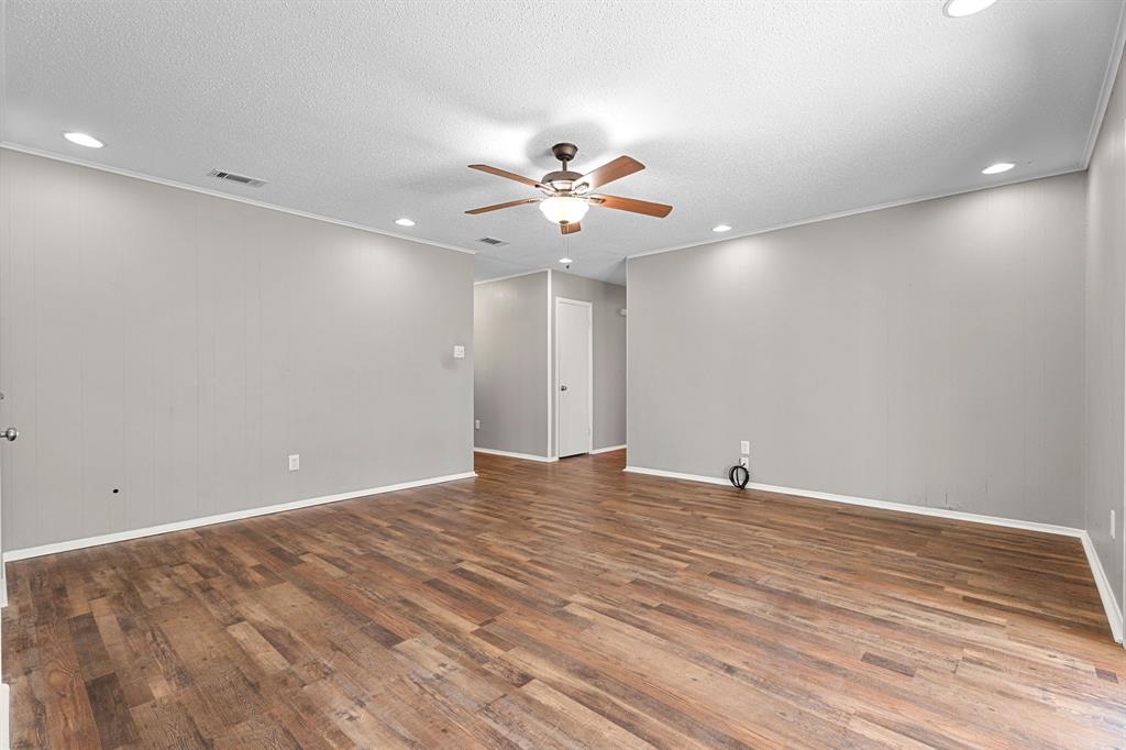 685 Sides Circle Canton, TX 75103 - Photo 9 of 32 a view of an empty room with a ceiling fan and a window