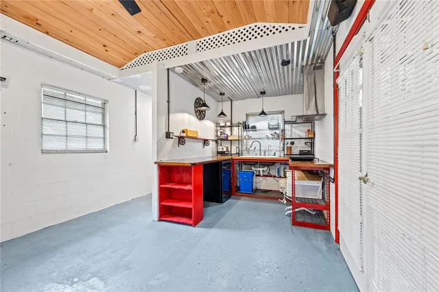 a view of a patio with couches table and chairs and potted plants