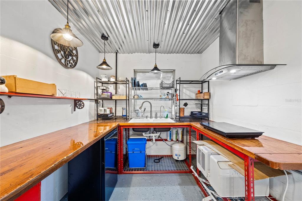 7 55th Street Yankeetown, FL 34498 - Photo 22 of 100 a kitchen with stainless steel appliances granite countertop a sink and cabinets