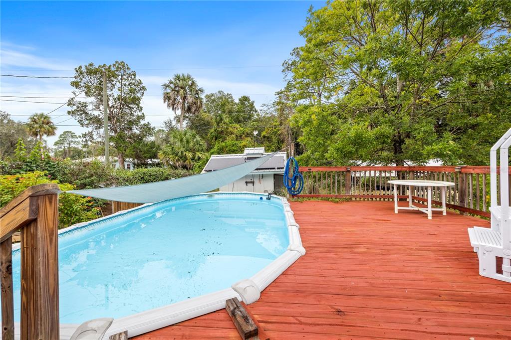 7 55th Street Yankeetown, FL 34498 - Photo 27 of 100 a balcony with wooden floor and outdoor seating