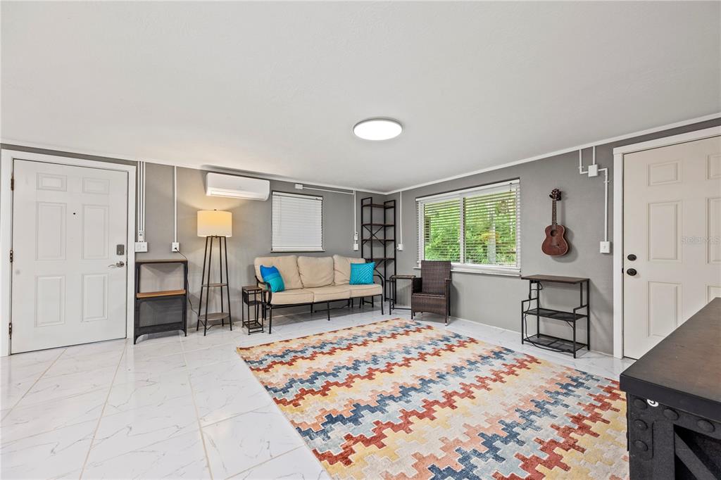 7 55th Street Yankeetown, FL 34498 - Photo 3 of 100 a bedroom with furniture and a window