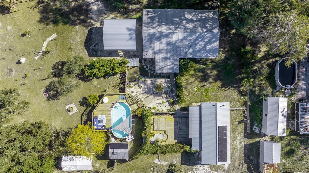 7 55th Street Yankeetown, FL 34498 - Photo 82 of 100 an aerial view of a house with a yard and large trees