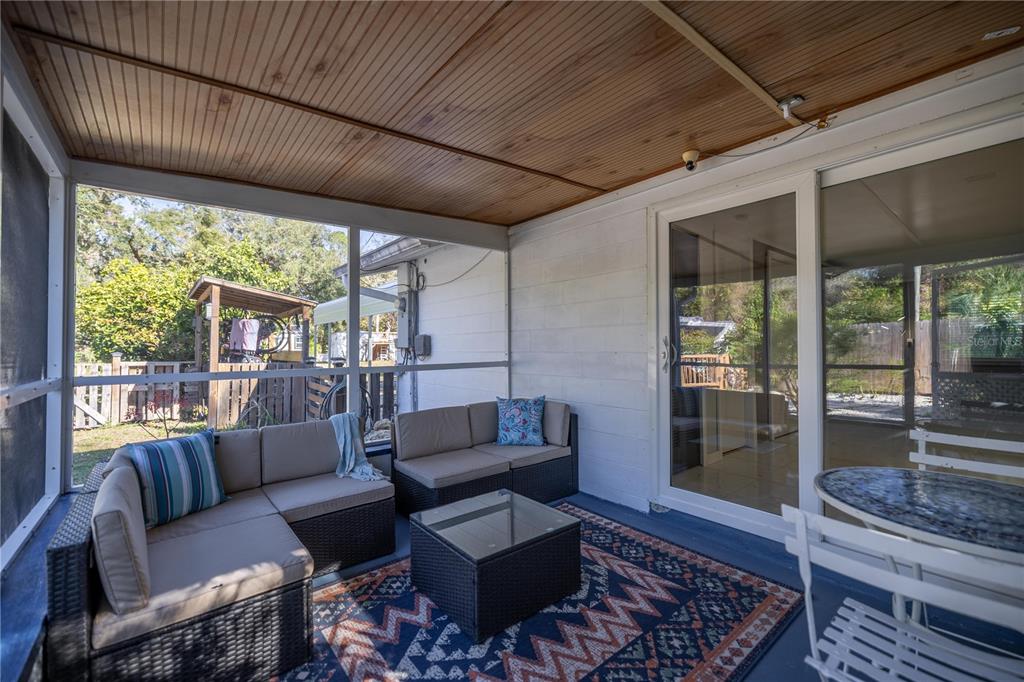 7 55th Street Yankeetown, FL 34498 - Photo 85 of 100 a living room with furniture and a floor to ceiling window