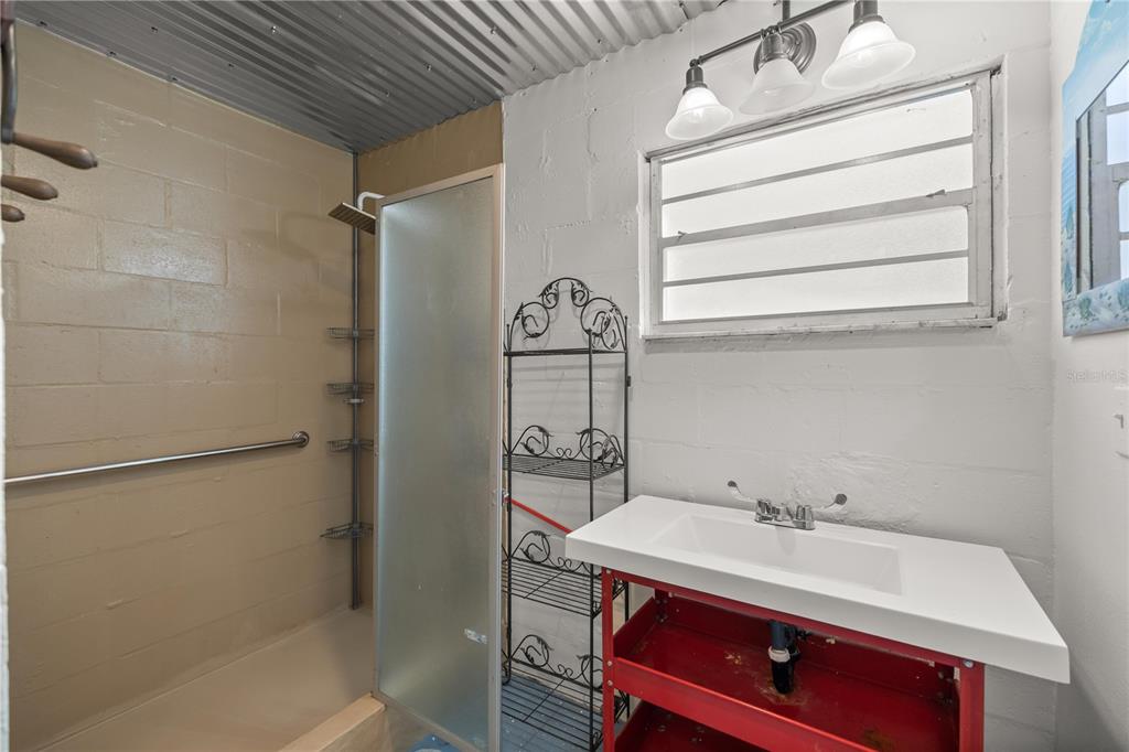 7 55th Street Yankeetown, FL 34498 - Photo 88 of 100 a bathroom with a sink and a mirror