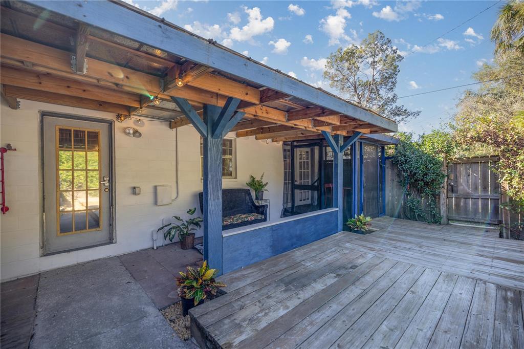 7 55th Street Yankeetown, FL 34498 - Photo 95 of 100 a view of a porch with wooden floor and potted plants