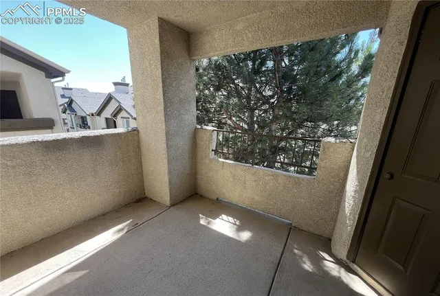 a view of an empty room with windows
