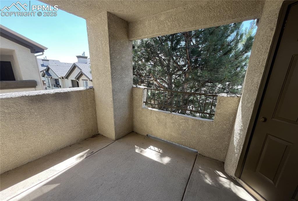 3927 Riviera Grove, Unit 203 Colorado Springs, CO 80922 - Photo 14 of 16 a view of an empty room with windows