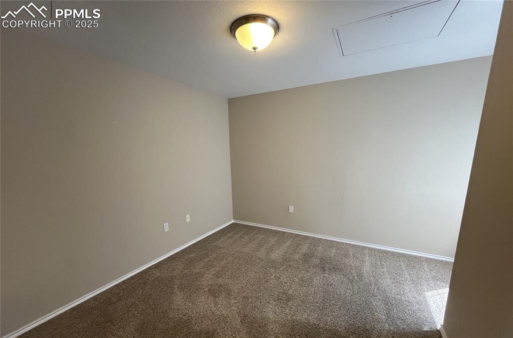3927 Riviera Grove, Unit 203 Colorado Springs, CO 80922 - Photo 10 of 16 an empty room with a window