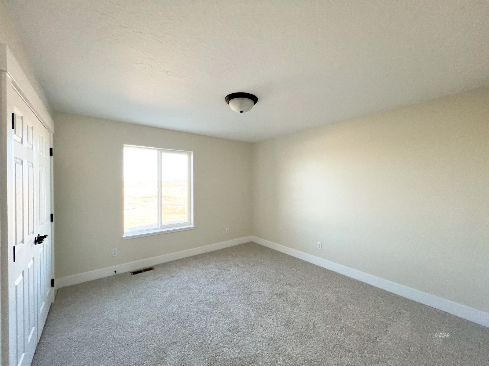 410 Ridgeway Drive Spring Creek, NV 89815 - Photo 13 of 26 an empty room with a window