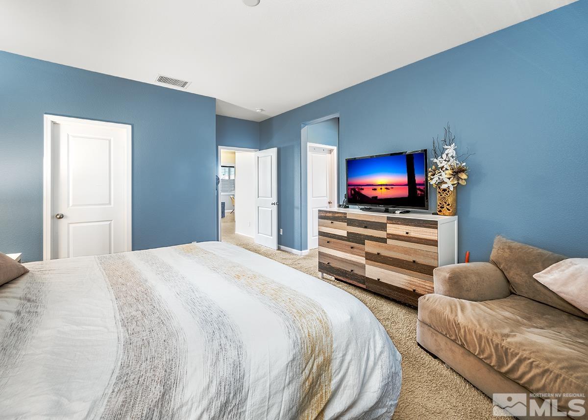1990 Hope Valley Drive Reno, NV 89521 - Photo 16 of 22 a bedroom with a bed and a television in it