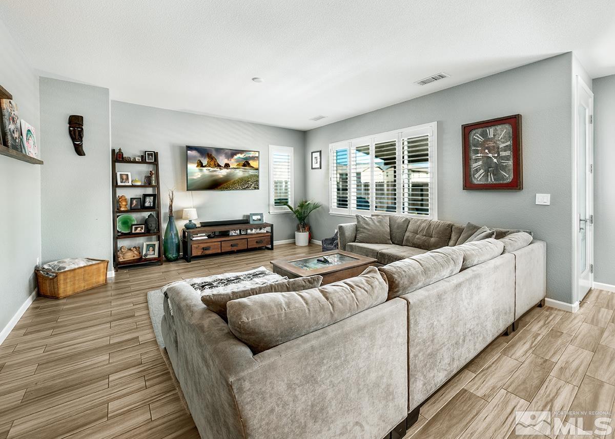 1990 Hope Valley Drive Reno, NV 89521 - Photo 6 of 22 a living room with furniture and a flat screen tv