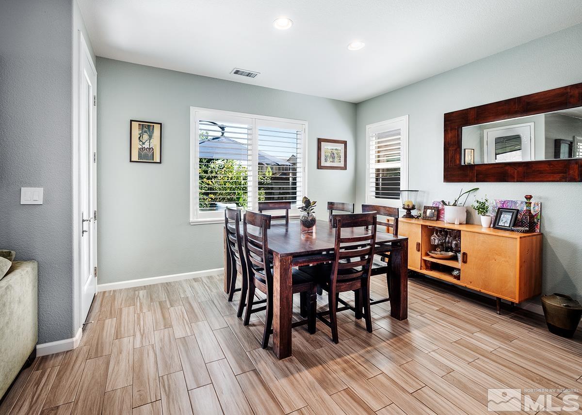1990 Hope Valley Drive Reno, NV 89521 - Photo 9 of 22 a view of a dining room with furniture window and wooden floor