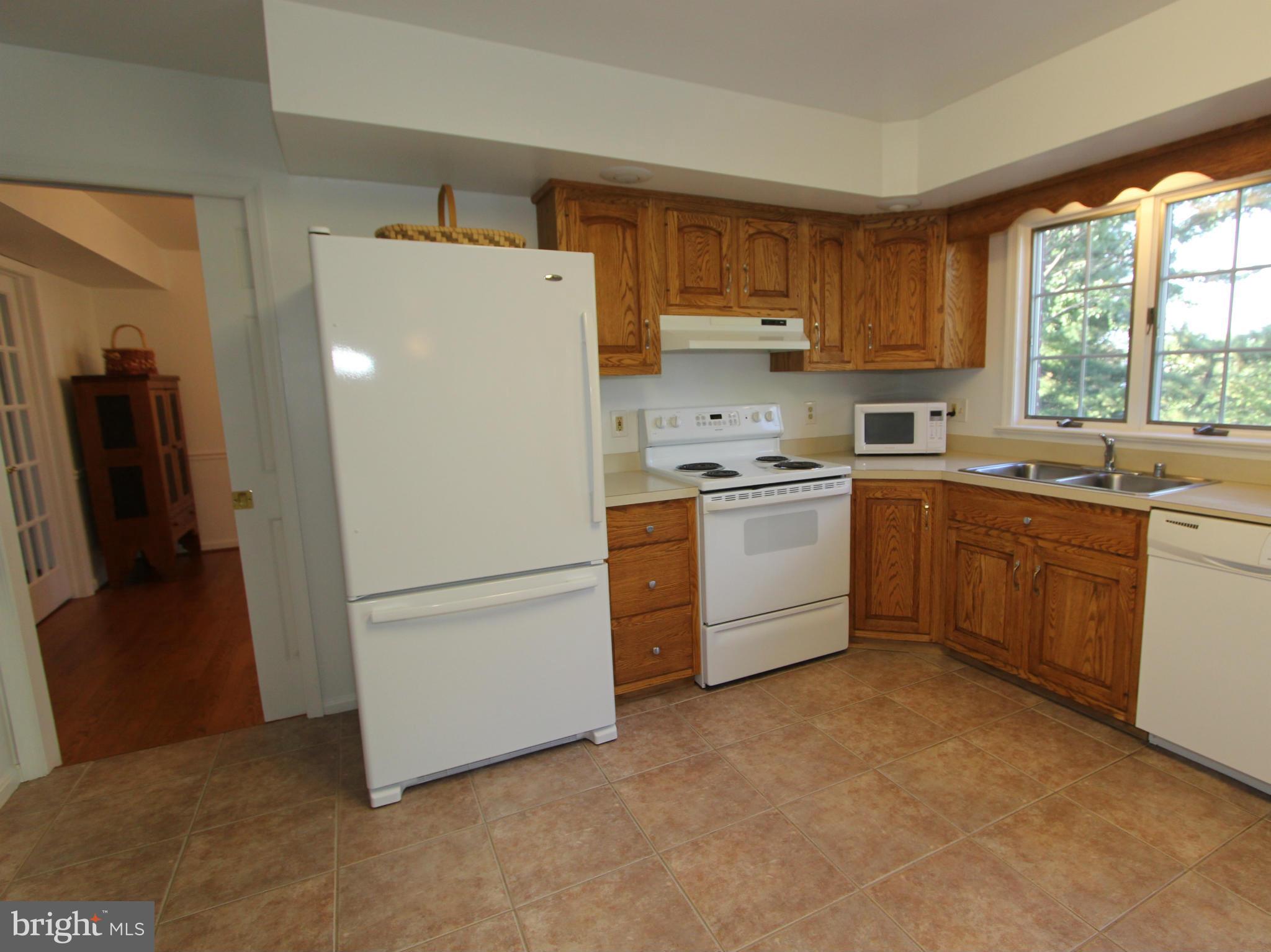 8129 Stone Ridge Drive Frederick, MD 21702 - Photo 4 of 30 Spacious Eat-In Kitchen W/ Ceramic Floors.