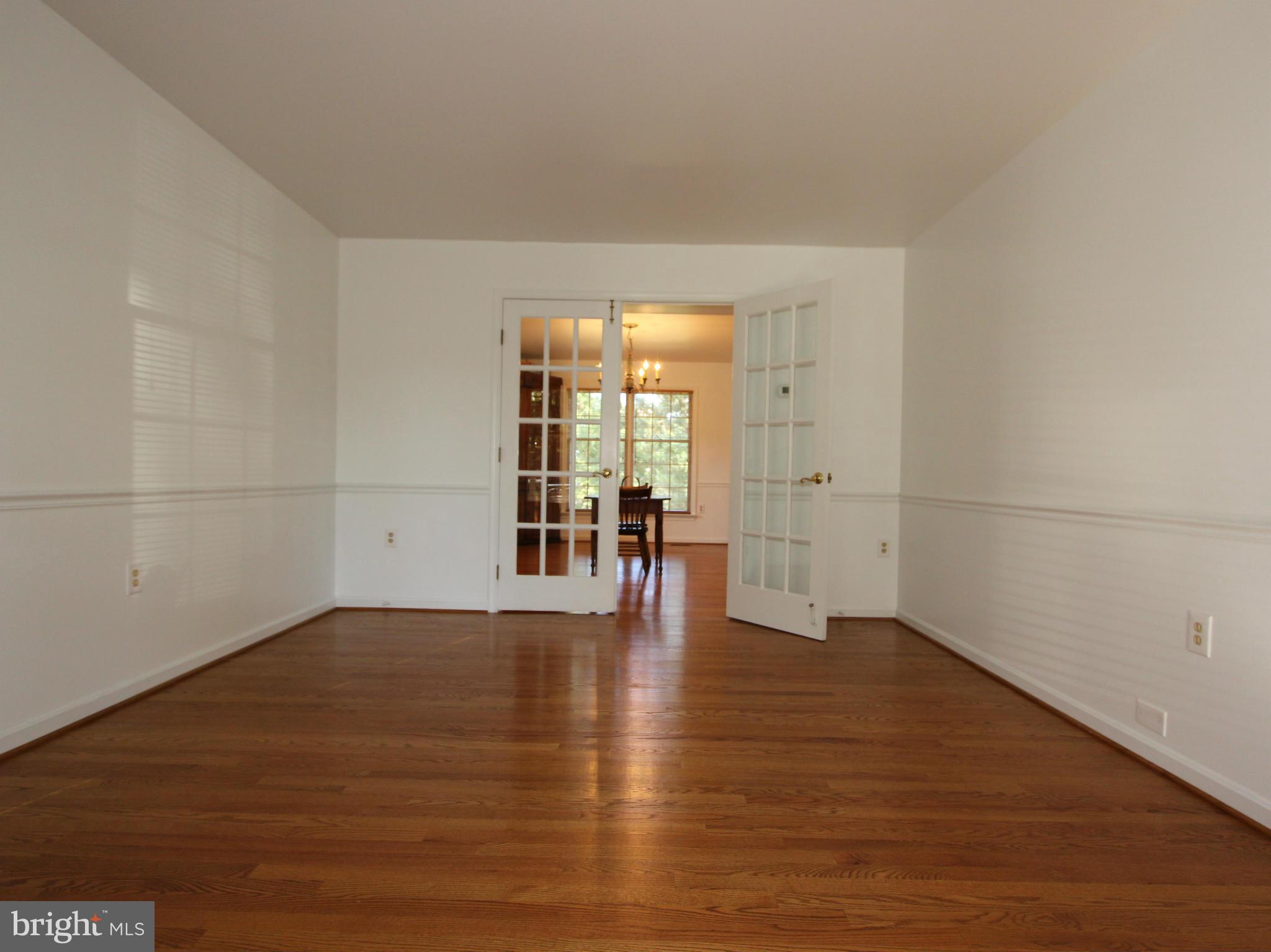 8129 Stone Ridge Drive Frederick, MD 21702 - Photo 6 of 30 Living Room With Gleaming Hardwoods.