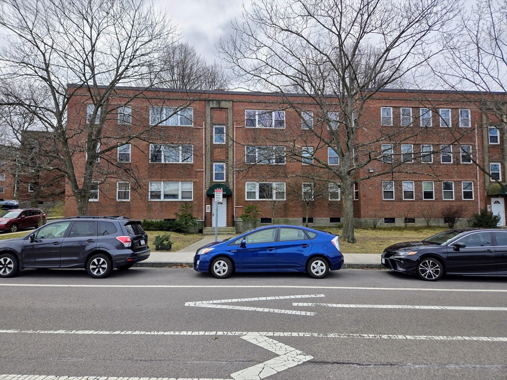 465 Arborway, Unit 13 Boston, MA 02130 - Photo 2 of 41 a cars parked in front of a building