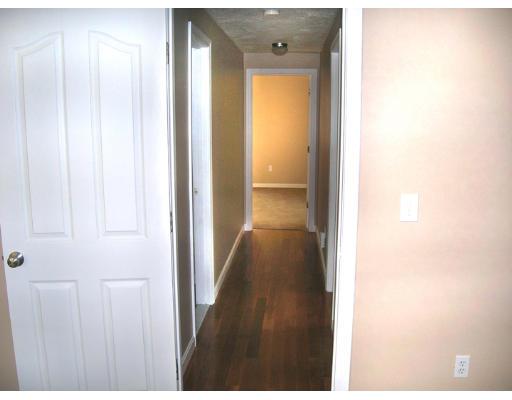 9 Cypress Road Groton, MA 01450 - Photo 7 of 13 a view of a hallway with wooden floor