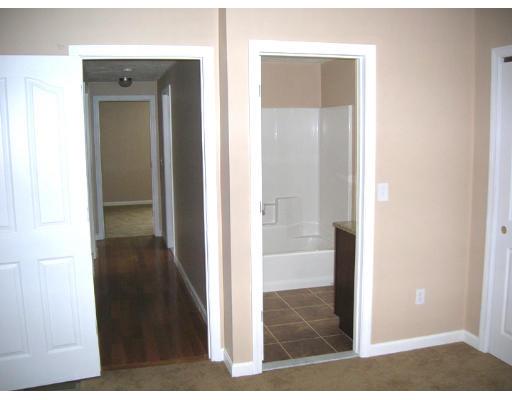 9 Cypress Road Groton, MA 01450 - Photo 8 of 13 a view of a bathroom from a hallway