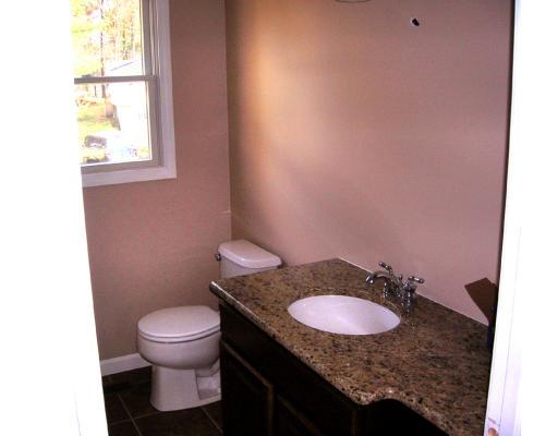 9 Cypress Road Groton, MA 01450 - Photo 10 of 13 a bathroom with a granite countertop sink and a mirror