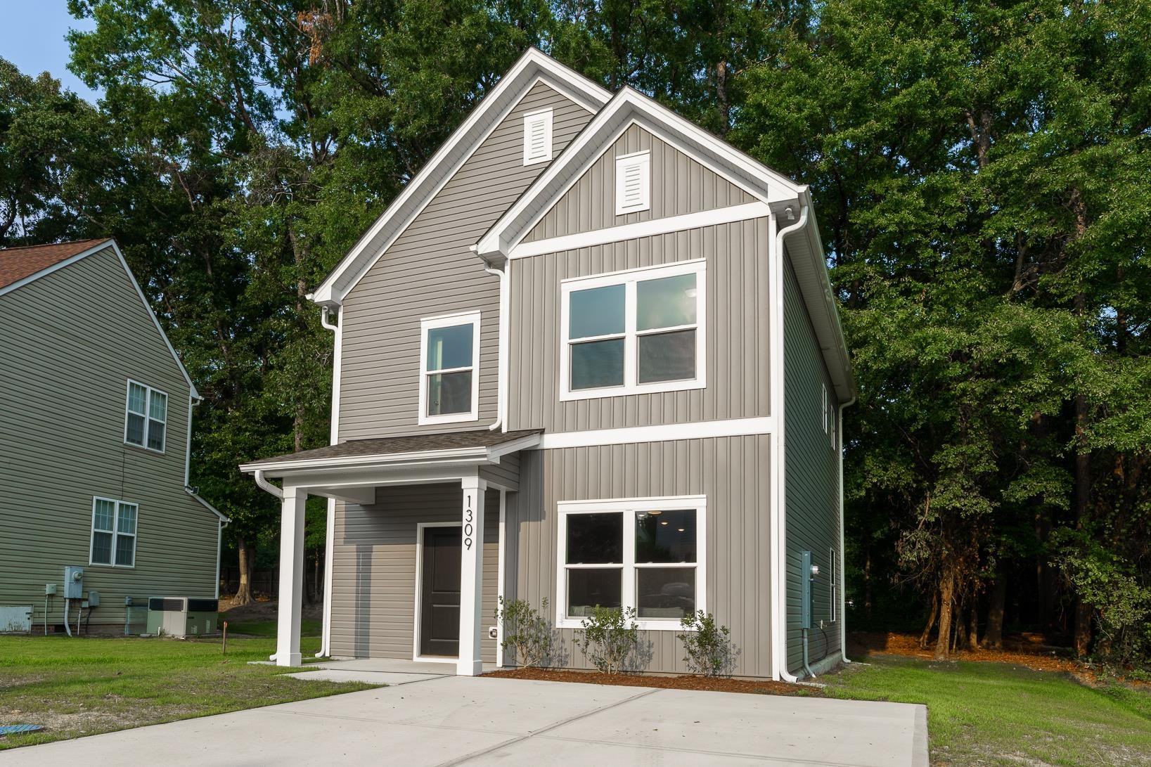 1309 Swingline Way Raleigh, NC 27610 - Photo 1 of 47 a front view of a house with a yard