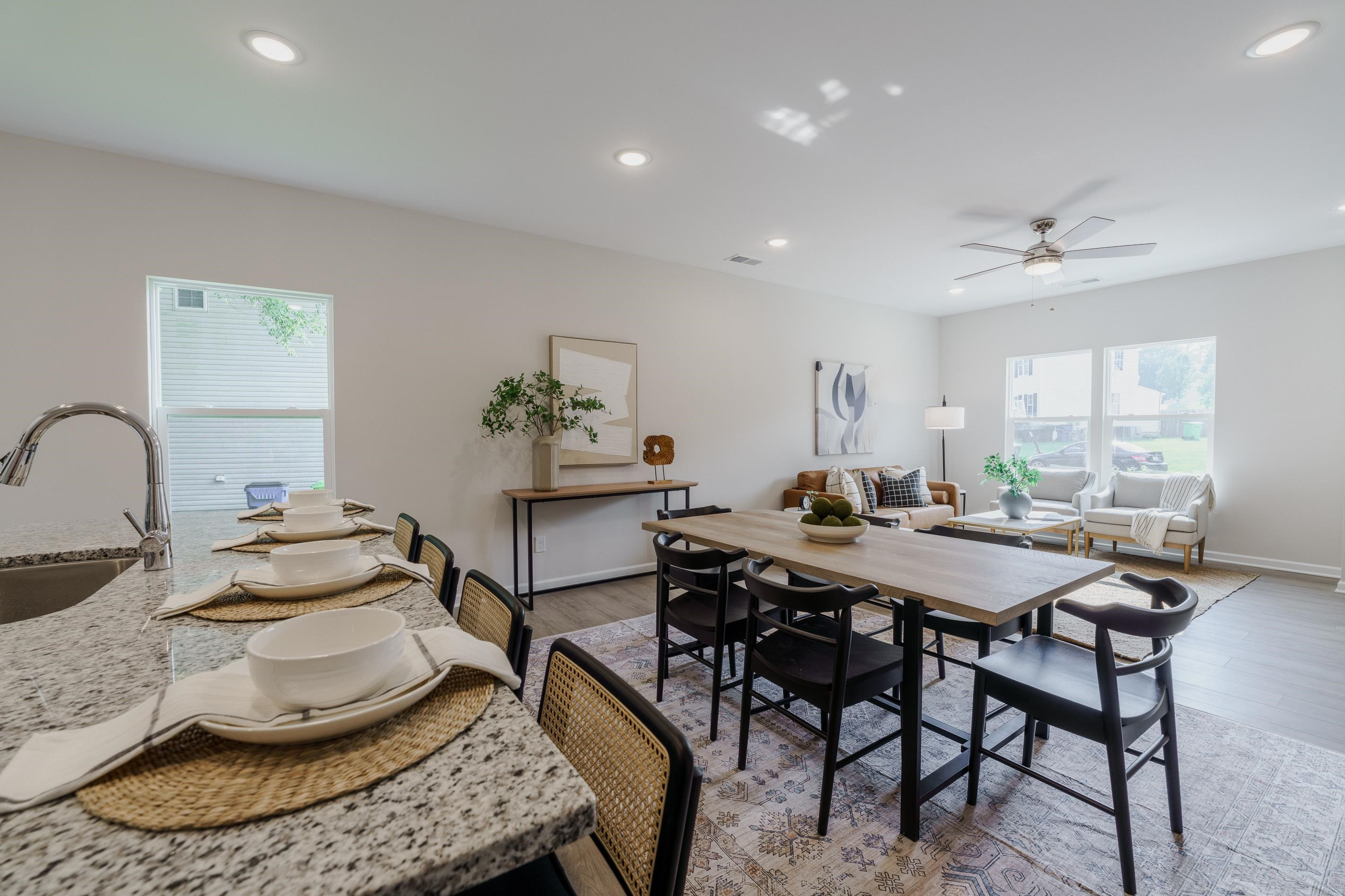 1309 Swingline Way Raleigh, NC 27610 - Photo 12 of 47 a kitchen with a table and chairs in it