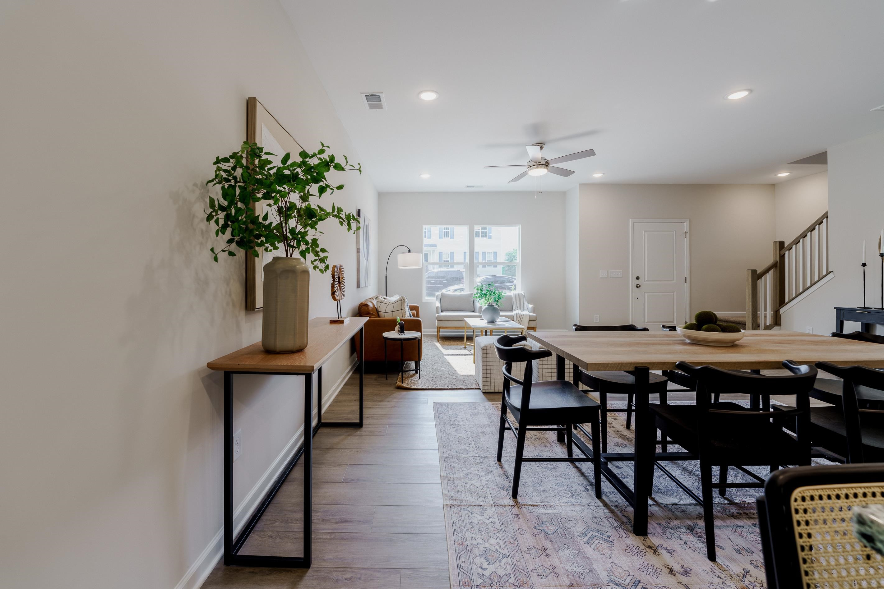 1309 Swingline Way Raleigh, NC 27610 - Photo 20 of 47 a living room with furniture a potted plant and a table