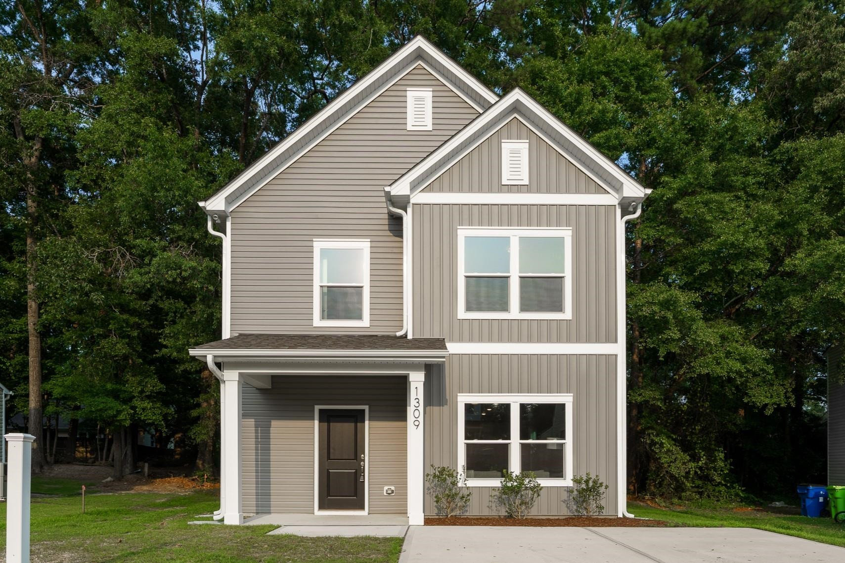 1309 Swingline Way Raleigh, NC 27610 - Photo 2 of 47 a front view of a house with garden