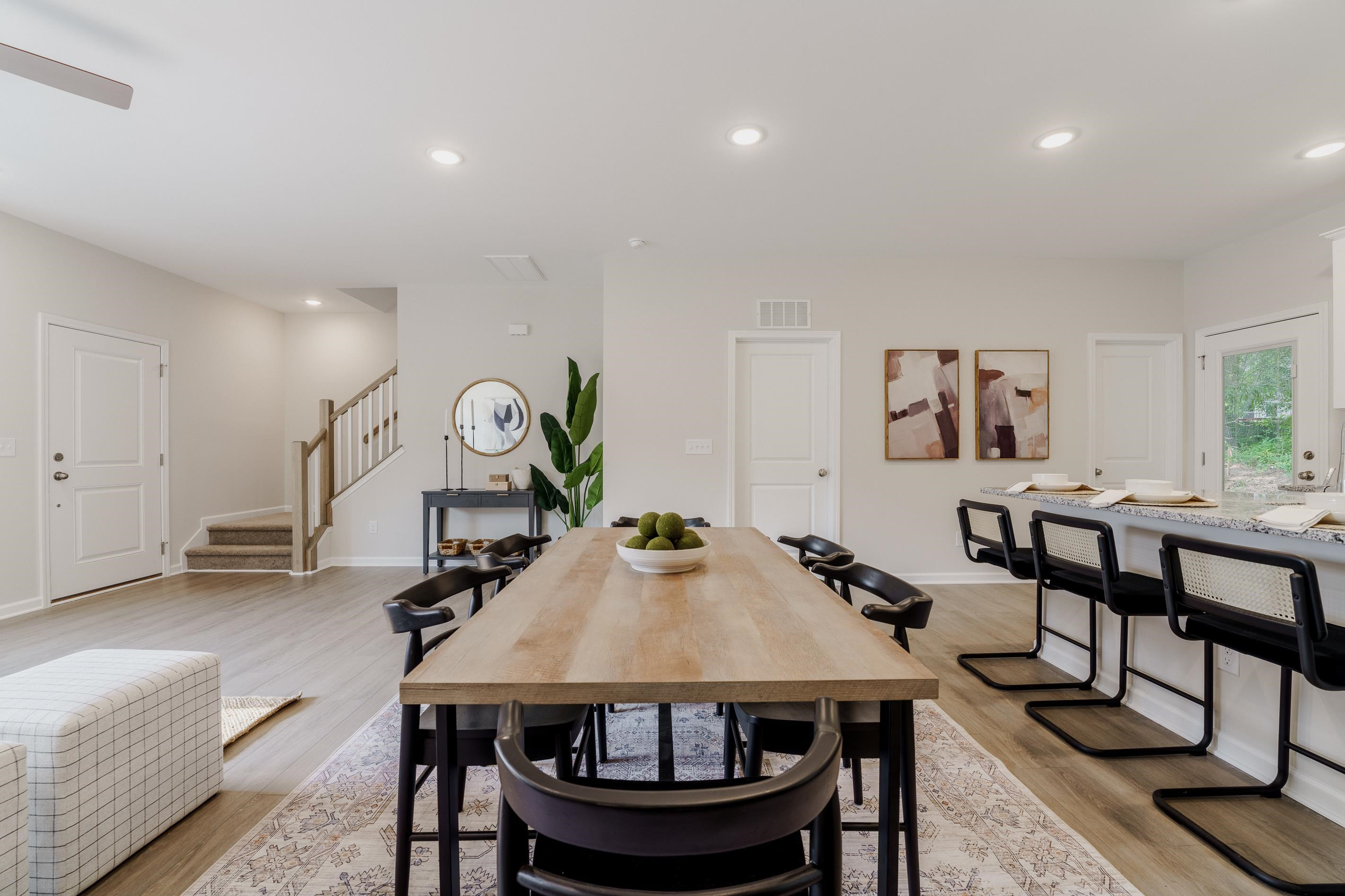 1309 Swingline Way Raleigh, NC 27610 - Photo 21 of 47 a view of a dining room with furniture and a chandelier