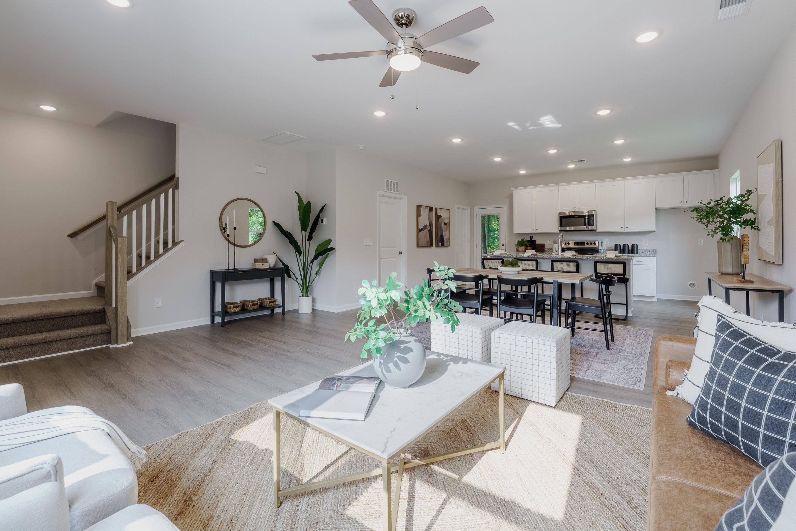 1309 Swingline Way Raleigh, NC 27610 - Photo 25 of 47 a living room with furniture and a view of kitchen